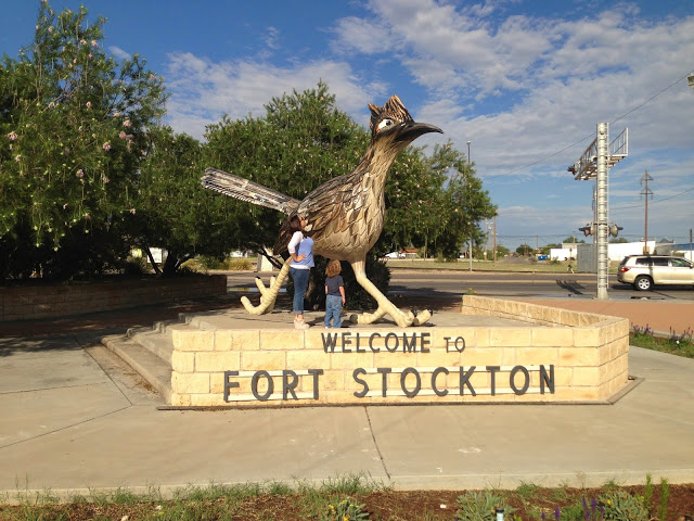 best family road trip: roadside attraction the world's former largest roadrunner statue in ft. stockton, tx