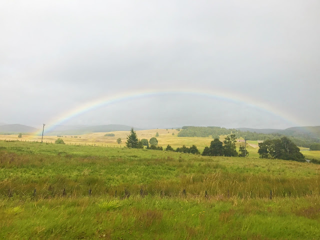 rainbow over the scottish highlands during our scotland road trip