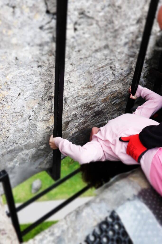 Kissing the Blarney Stone at Blarney Castle in County Cork, Ireland