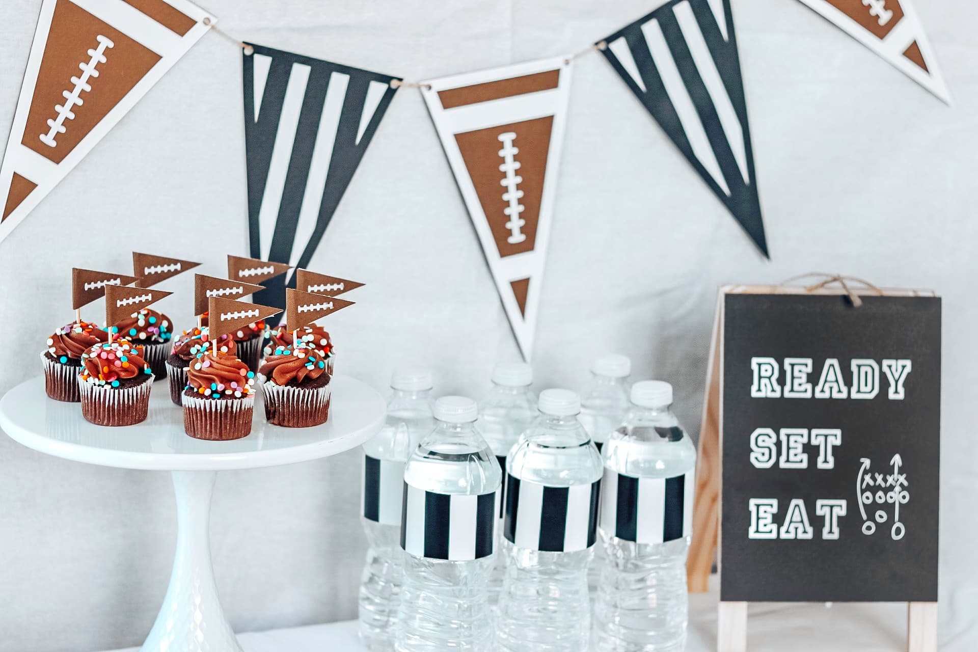Easy DIY football party decor - striped water bottle wrappers