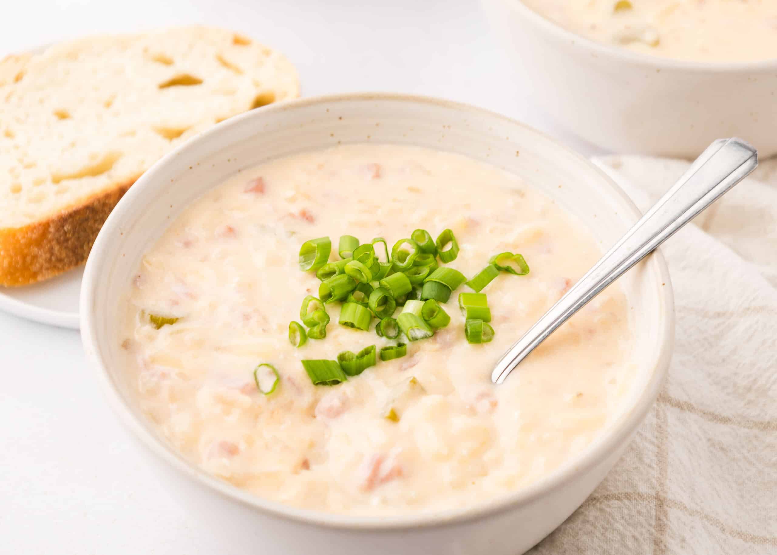 The BEST Slow Cooker Cheesy Potato and Ham Soup (Crock Pot potato soup with frozen diced potatoes and cream cheese)