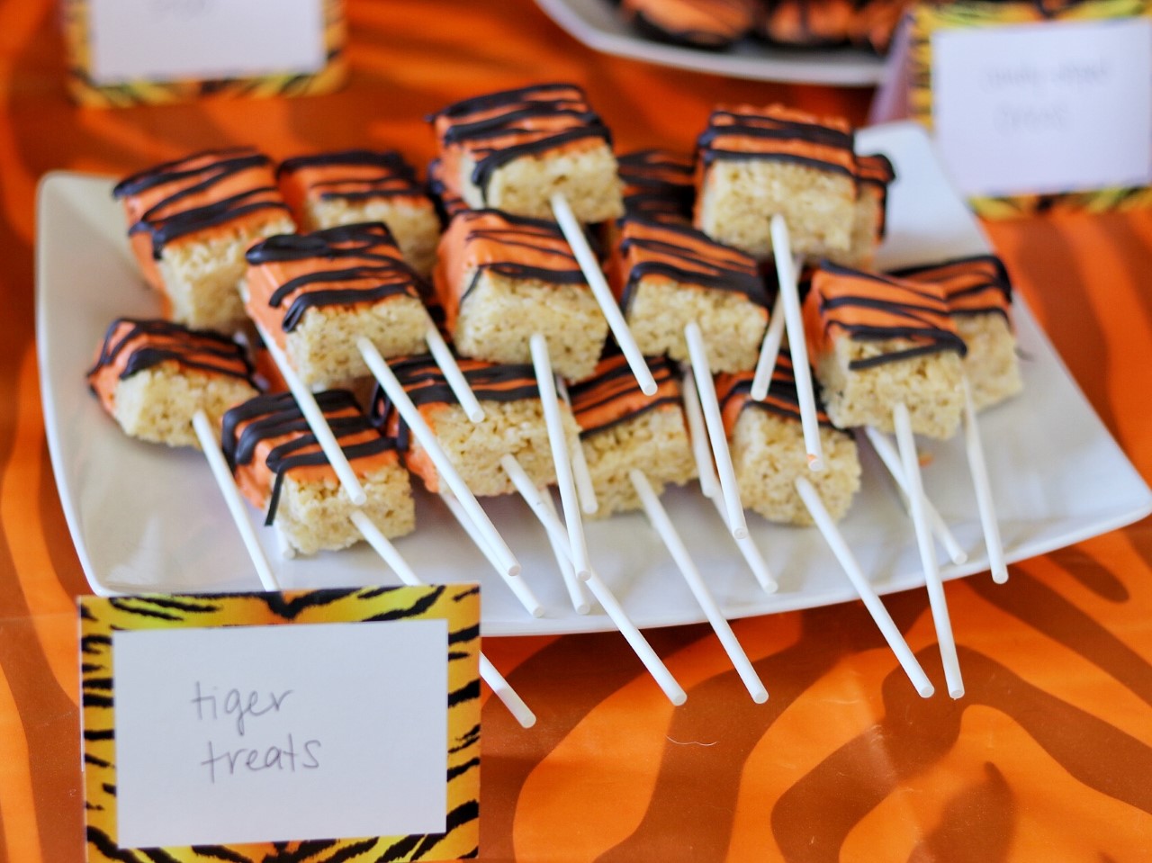 Tiger Treats - rice krispie treats dipped in orange candy melts with black stripes