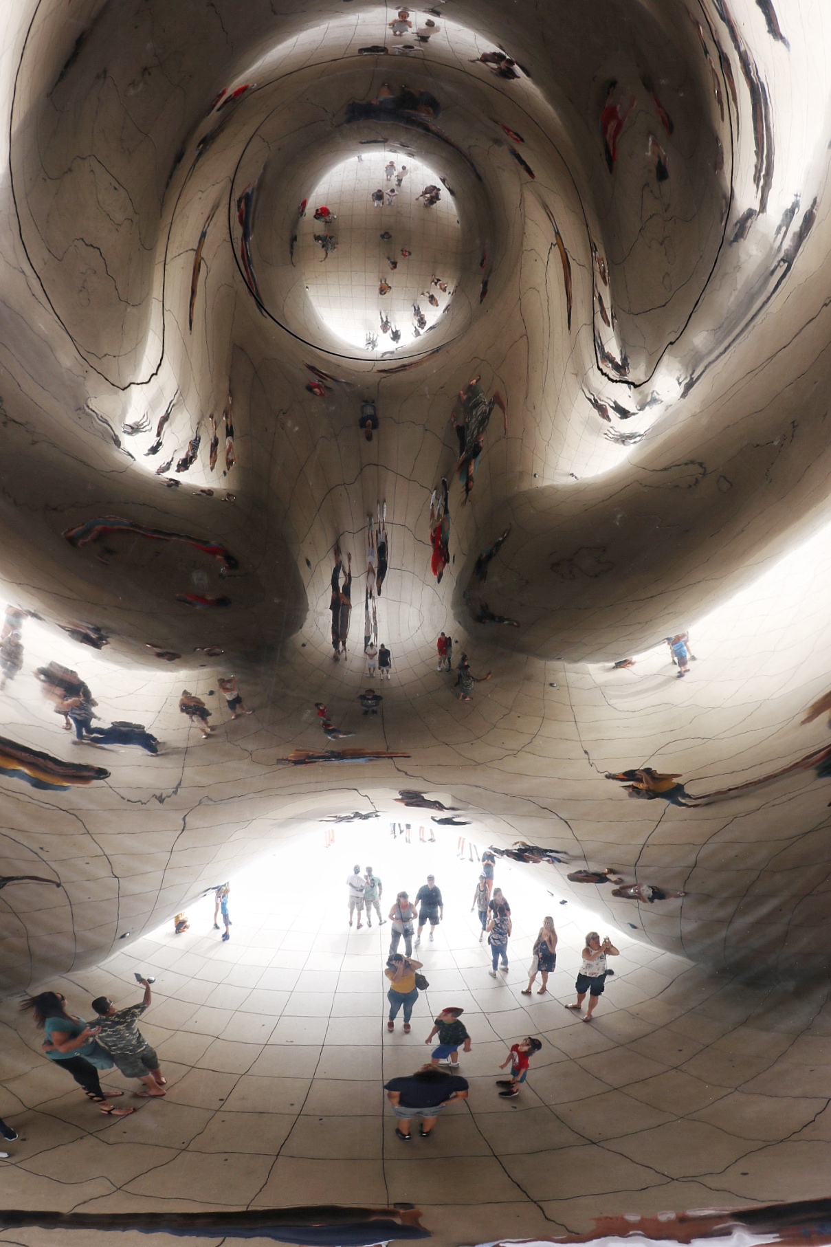 family activities in chicago for a vacation with kids: cloud gate sculpture, aka the bean, in millennium park