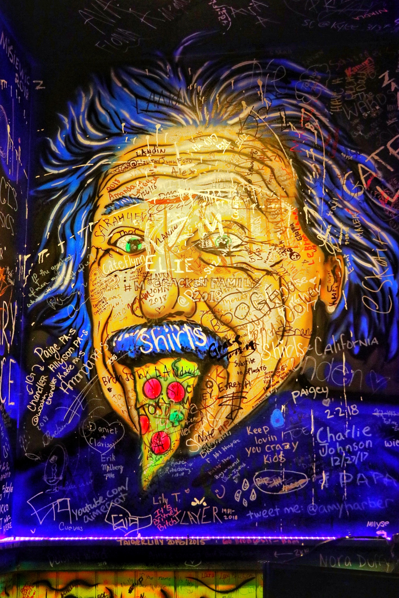 wall art and graffiti at the original gino's east location on superior street and michigan avenue