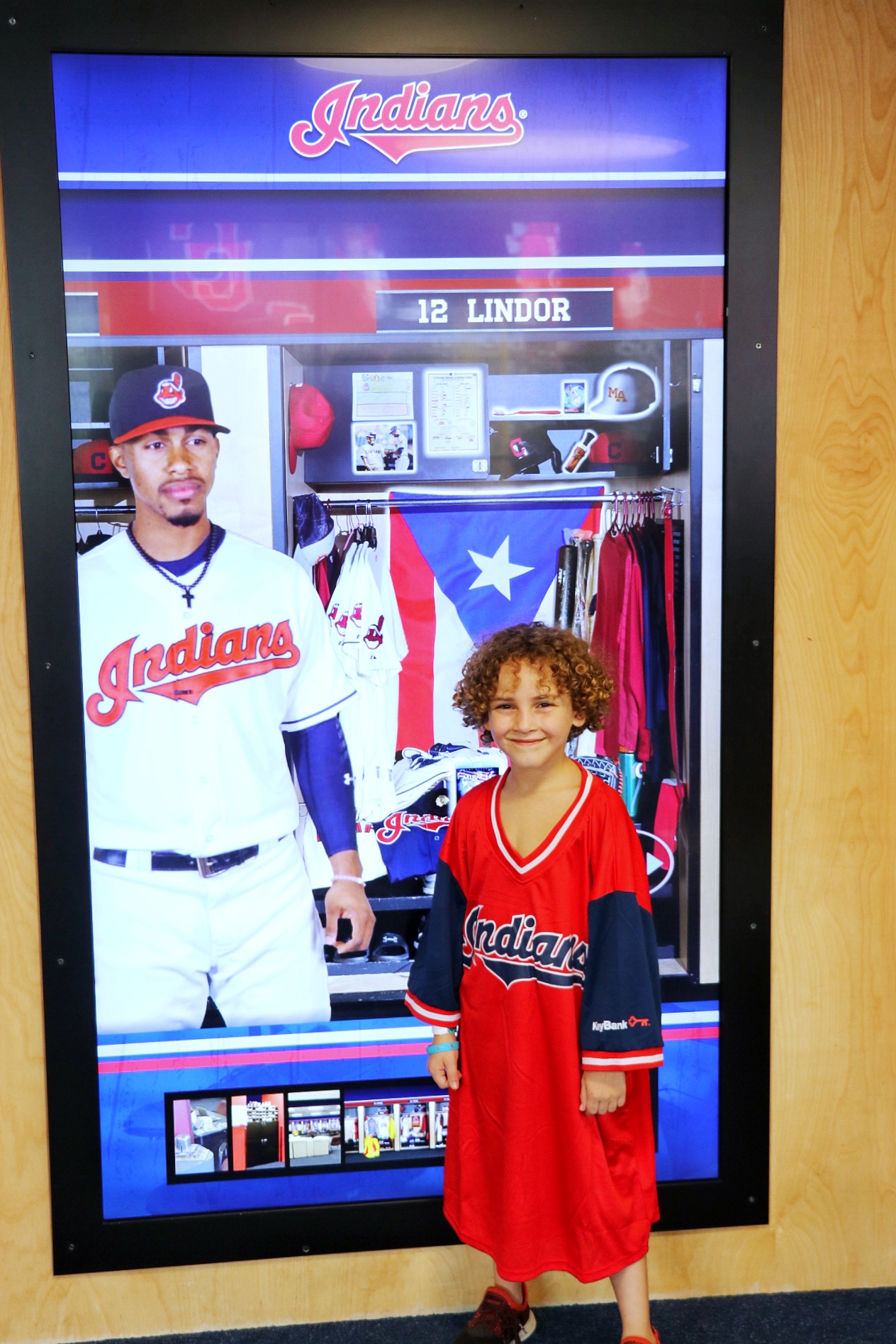kid wearing a one-size fits all freebie francisco lindor mr. smile jersey at the cleveland guardians game