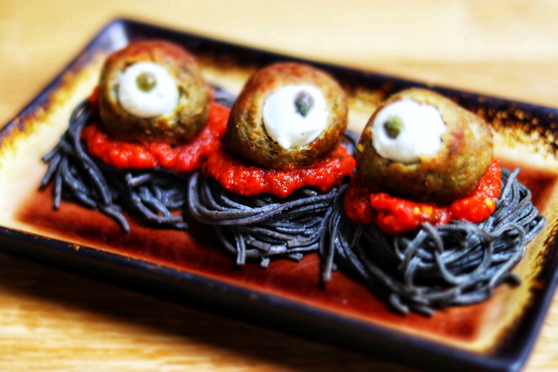 quick and easy kid-friendly Halloween recipe idea: spooky spaghetti with meatball eyeballs