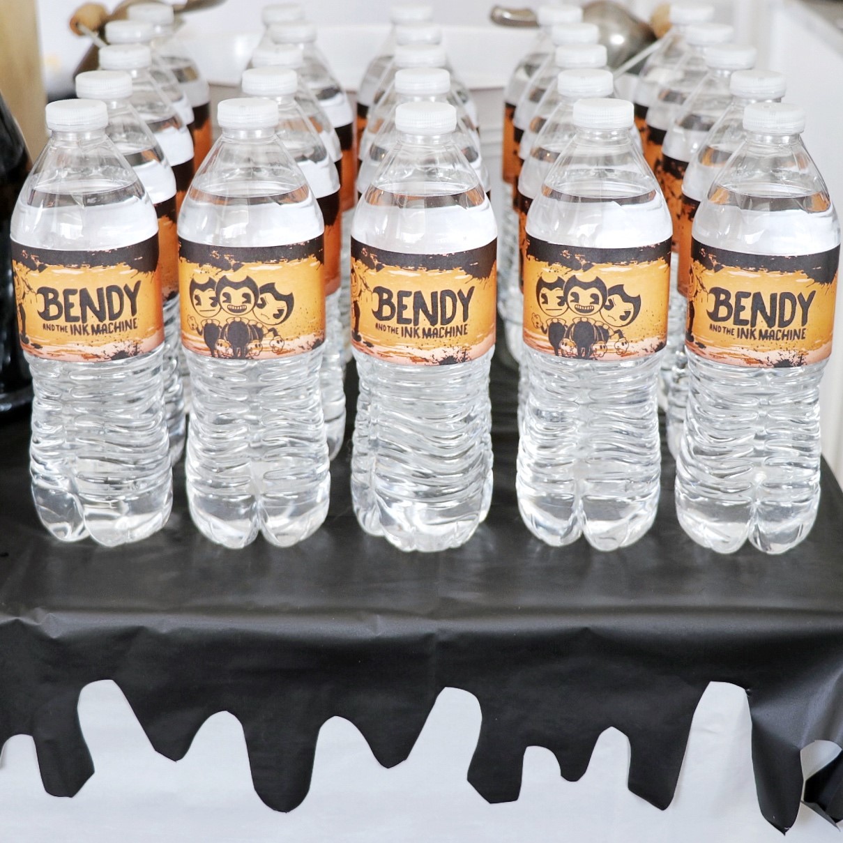 Food and decor idea for a Bendy birthday party: free printable BATIM water bottle labels