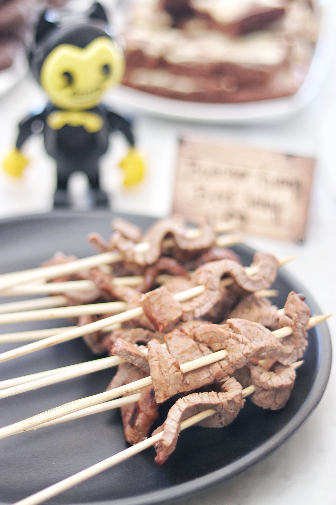 Food ideas for a Bendy and the Ink Machine themed birthday party: Butcher Gang beef satay skewers 