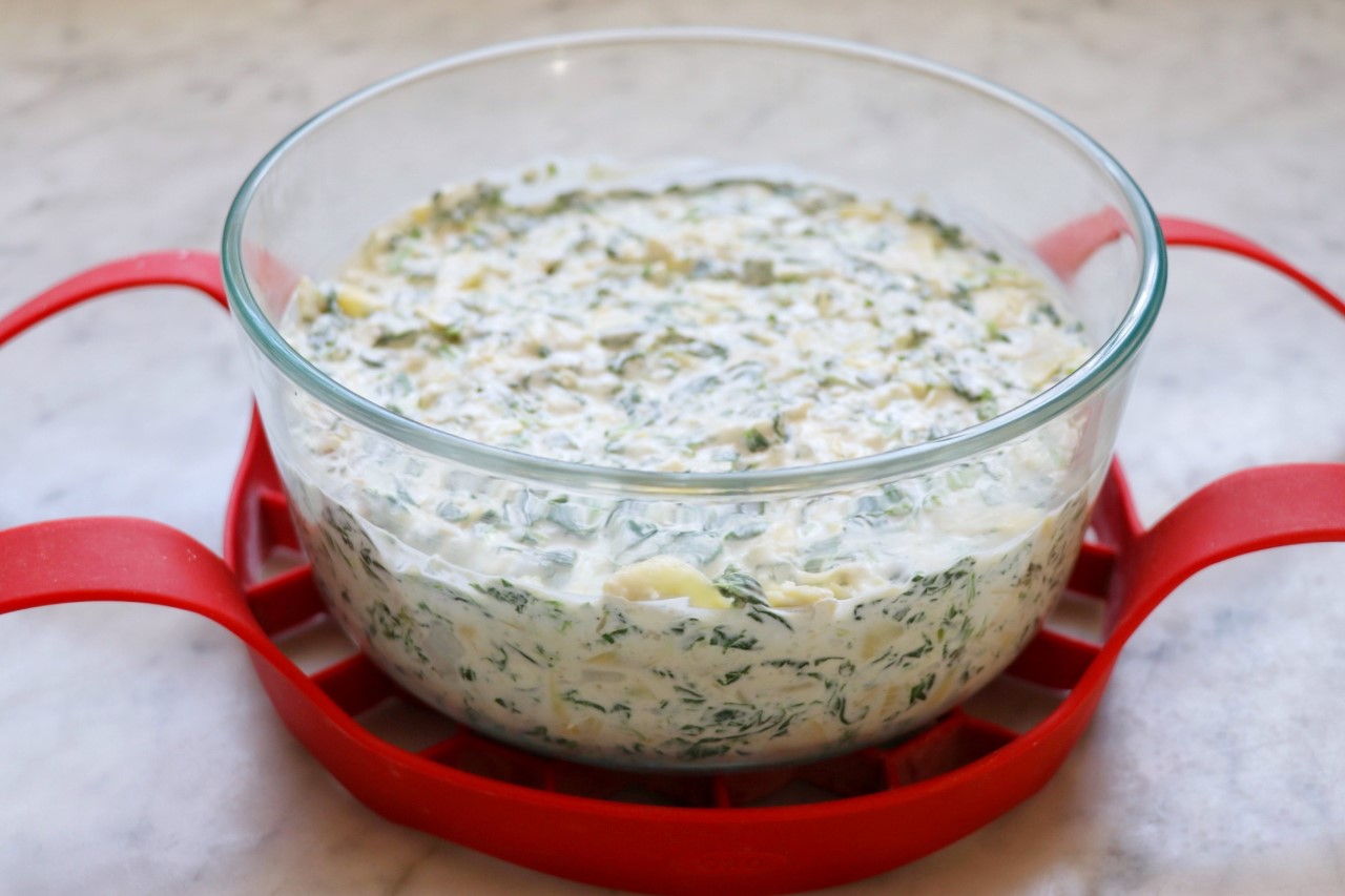 Instant Pot Feta, Spinach, and Artichoke Dip recipe on a bakeware sling
