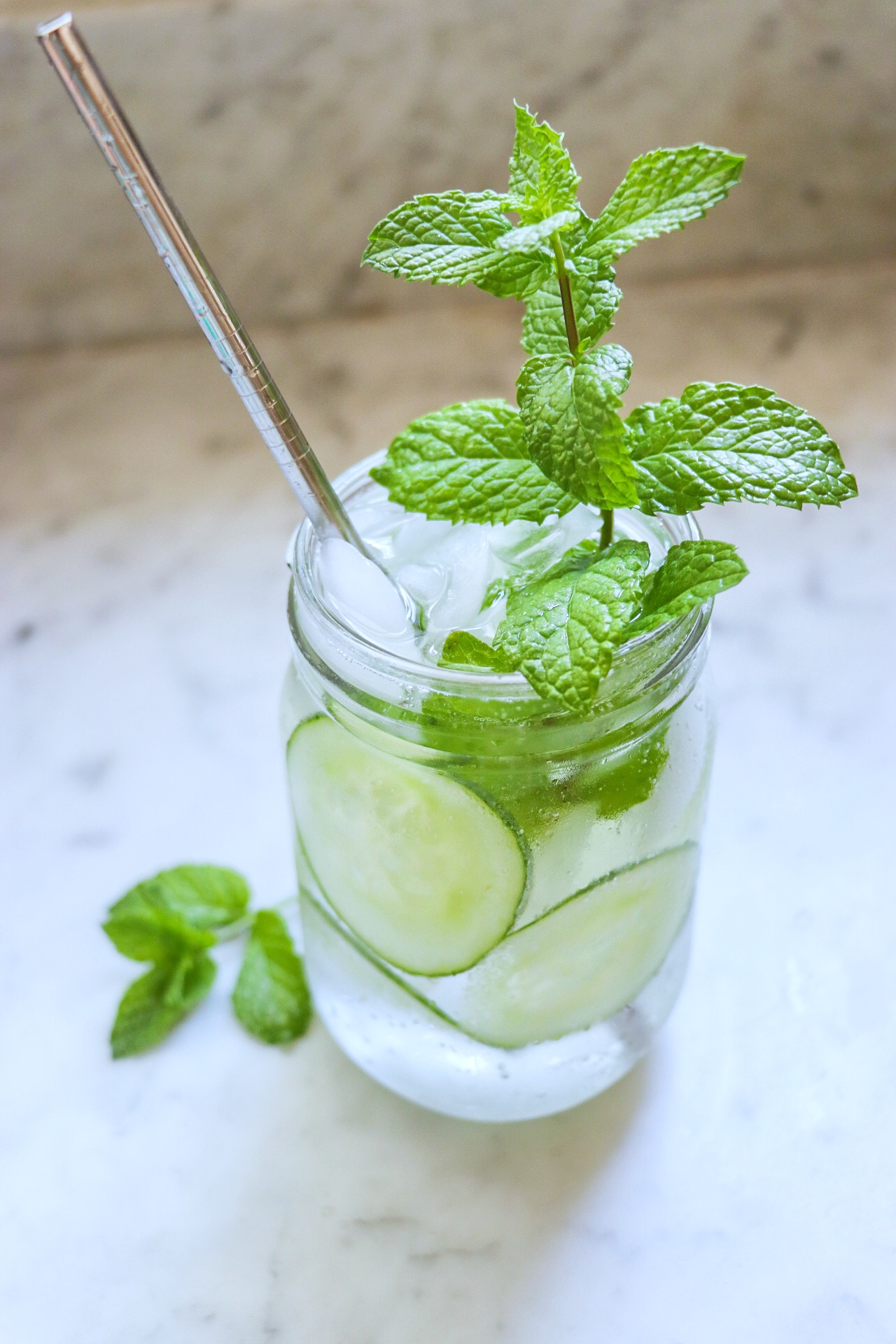 Refreshing sparkling mocktails with mint, basil, and rosemary - Fab