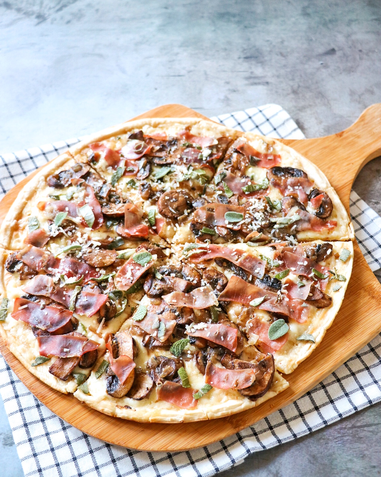 white truffle pizza with prosciutto and mushroom