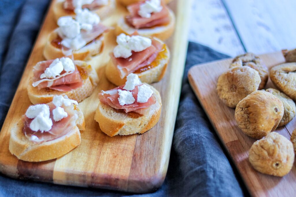 Prosciutto, Fig, and Goat Cheese Crostini (crostini with goat cheese and fig jam)