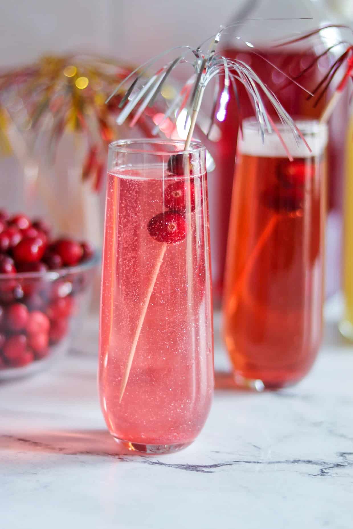 Cranberry Sparkler gin prosecco cocktail with edible glitter for New Year's Eve