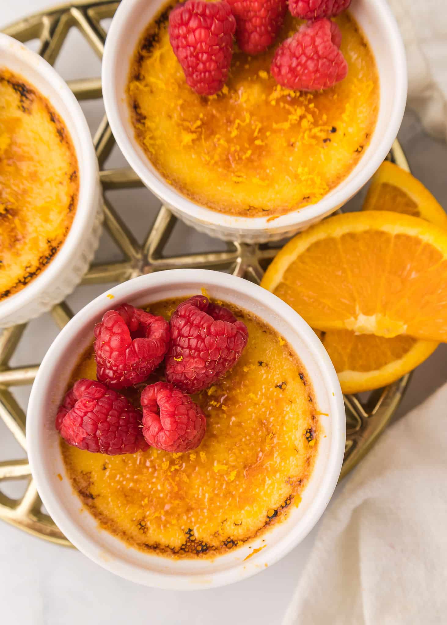 Honey-Orange Crème Brûlée with Raspberries