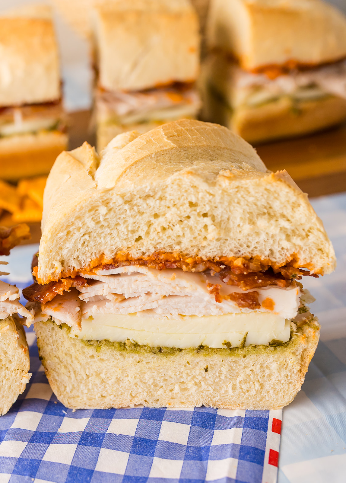 easy picnic sandwich recipes: Tote-and-Slice Turkey, Bacon, and Pesto Loaf Sandwiches