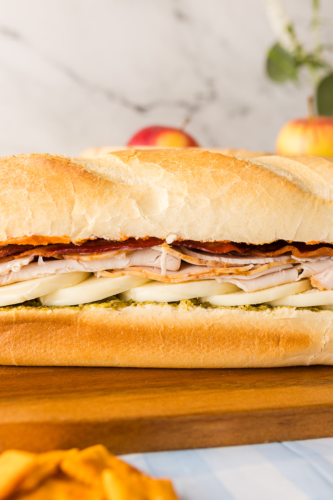 picnic sandwich recipes: Tote-and-Slice Turkey, Bacon, and Pesto Loaf Sandwiches
