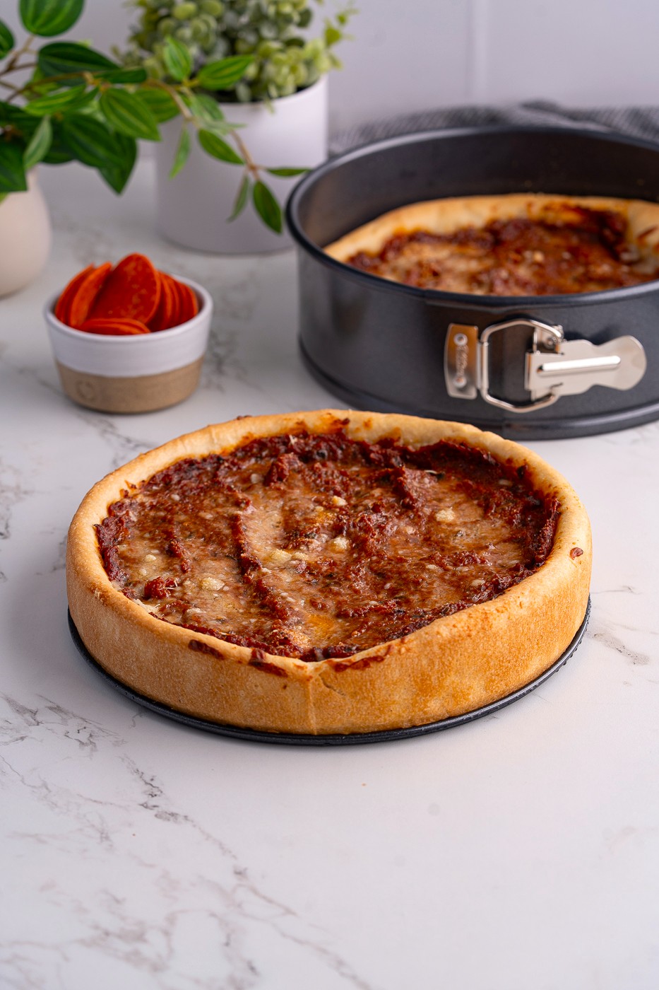 deep dish pizza in springform pan