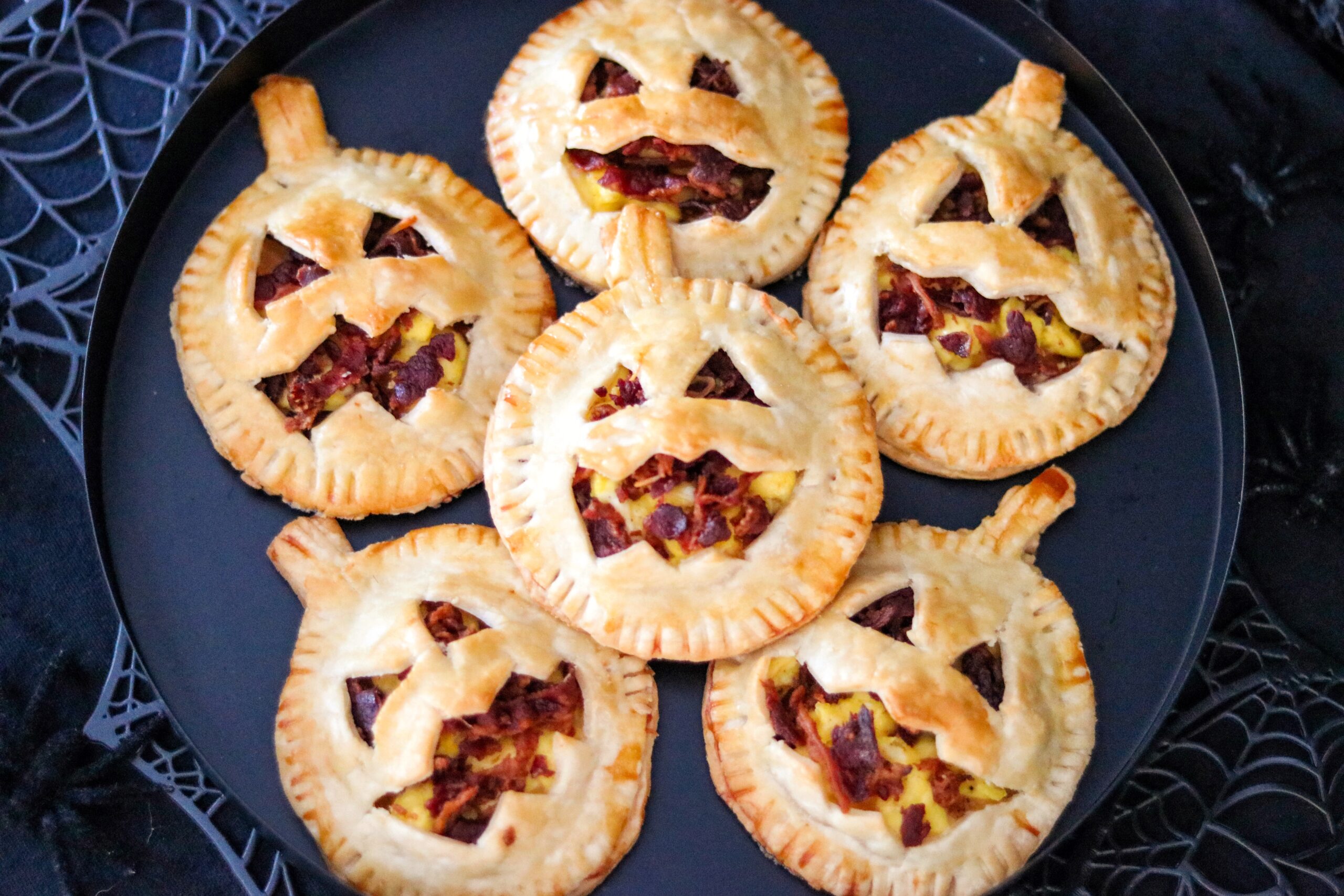 Jack-O-Lantern Breakfast Hand Pies (savory Halloween breakfast ideas)